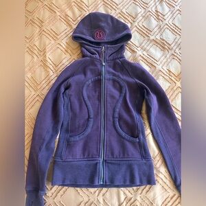 Lululemon purple hooded jacket with red accents. Size 2